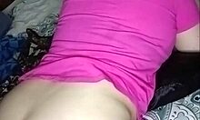 Chubby housewife carefully cores her shiny snow apple in the kitchen