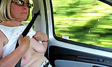 Going down the road with my tits out.