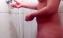 Hot young girl taking a shower in the bathroom