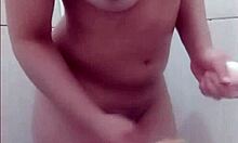 Hot young girl taking a shower in the bathroom