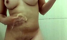 Hot young girl taking a shower in the bathroom