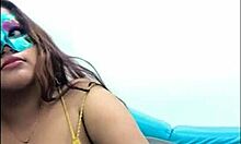 brunette student takes questionnaire, touches breasts sexy way