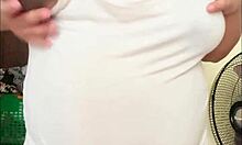 Pregnant arab girl with a big belly and milky boobs