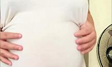 Pregnant arab girl with a big belly and milky boobs