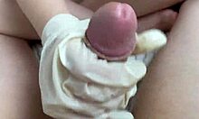 Step sister tenderly masturbates cock in latex gloves with oil from POV.