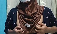 Beautiful hijab-wearing student indulges in private toy exploration when the house is quiet