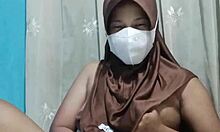 Beautiful hijab-wearing student indulges in private toy exploration when the house is quiet