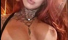 Redhead teases fans with pink tits