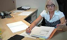 Young Blonde Doctor With Glasses And Old Patient