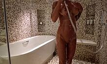 Lovely Monika Fox strips naked in the shower, showing her pierced nipples and big tits.