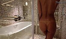 Lovely Monika Fox strips naked in the shower, showing her pierced nipples and big tits.