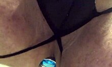 Wearing black lingerie with a butt plug, what are you up to?