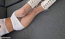 Perfect-assed milf in high-heeled boots and fishnet stockings
