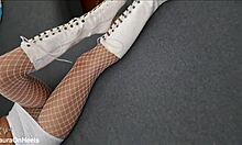 Perfect-assed milf in high-heeled boots and fishnet stockings