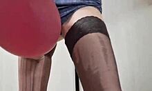 Mistress Elza Kom popped balloons during a sexy session with her sub.