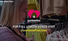 Girlfriend kneels in the changing booth to suck his cock