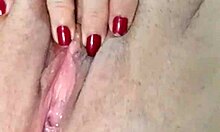 she spreads her huge natural tits and feet while teasing her swollen clit and big pussy lips