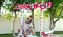 COLLEGE LESBIANS LICK PUSSY In PUBLIC Kissing Booth
