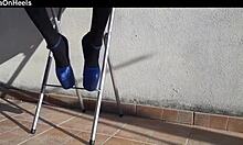 she slips into denim shorts over black tights with killer heels