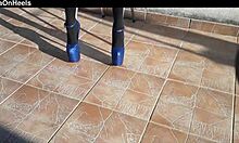 she slips into denim shorts over black tights with killer heels