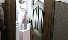 whoa sexy blonde milf in bathroom no panties roommate spies and jerks outside 👀💦🚿