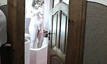 whoa sexy blonde milf in bathroom no panties roommate spies and jerks outside 👀💦🚿