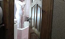 whoa sexy blonde milf in bathroom no panties roommate spies and jerks outside 👀💦🚿