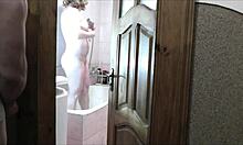 whoa sexy blonde milf in bathroom no panties roommate spies and jerks outside 👀💦🚿