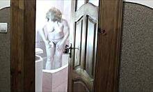 whoa sexy blonde milf in bathroom no panties roommate spies and jerks outside 👀💦🚿