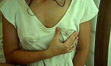 Skinny brunette petite with small natural tits squirts milk close-up from lactating nipples