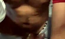 three guys crowd bathroom stall for sneaky hand grabs