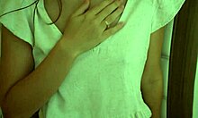 Skinny brunette petite with small natural tits squirts milk close-up from lactating nipples