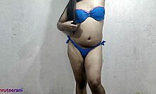 indian shemale crossdresses in blue bikini stroking big tits and ass solo