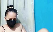 Bikini babe masturbates her pussy using a huge dildo