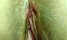 Horny mature wife massages meaty shaved pussy lips closeup