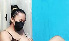 Bikini babe masturbates her pussy using a huge dildo