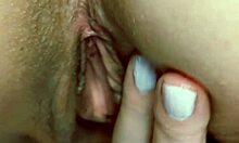 Horny mature wife massages meaty shaved pussy lips closeup