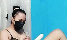 Bikini babe masturbates her pussy using a huge dildo