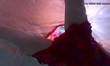 nikita vodorezova strips her redhead tits naked fast right underwater in the pool.