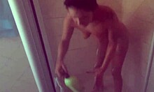 Pierced nipples glisten as tattooed body soaps up seductively in shower