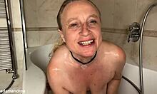 Chubby blonde mommy spreads big pussy lips with dildo in bathroom bath