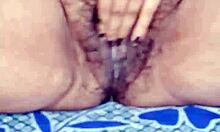 Indian beauty squeezes massive boobs while fingering wet hairy pussy