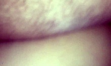 Oiled body bent over for painful doggystyle relief