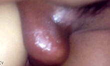 Oiled body bent over for painful doggystyle relief