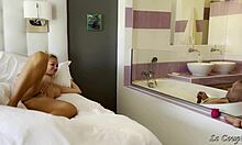 Husband strokes cock in tub watching wife grind dildo on glass wall moaning loud