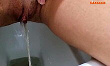 horny milf pisses in toilet while shaving her close-up pussy