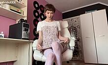 Slim brunette euro babe in dress and lingerie strips teases her shaved pussy to quick orgasm