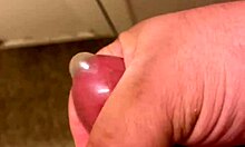 i'm stroking my pussy so hard with this condom chasing that wild orgasm...