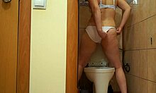 this sexy milf brunette bends over in lingerie peeing tons from her hairy wet pussy right through white panties doggy style fetish clip