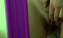 she stands in front of the mirror slowly teasing her curvy body into frenzy